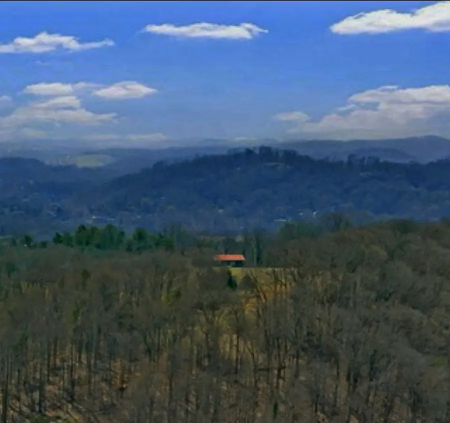 Layers of hills fading into haze in the distance beyond the valley